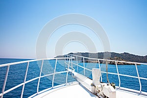 View of the mountains and the sea from the bow of the ship