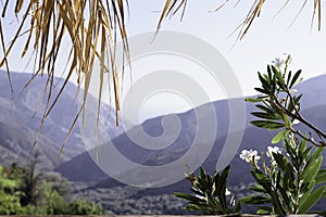 The view of the mountains and the sky from the window of the terrace