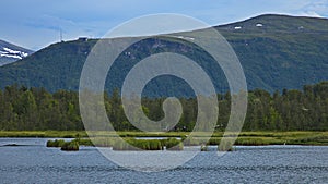 View of the mountains Storsteinen and Floya from the lake Prestvannet in Tromso in Troms county, Norway