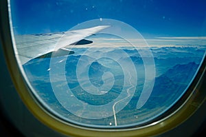 View of mountains and valley from airplane window