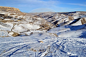 View of the mountains valley in winter. Ski slopes. Caucasus, Russia