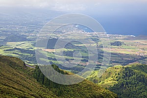 View on mountains, valleys, sea coastline of Sao Miguel island