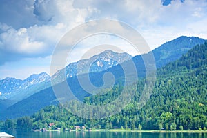 View of the mountains and the Weissensee lake in cloudy weather