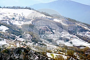 View of the mountainside from the village in Serbia in the winter