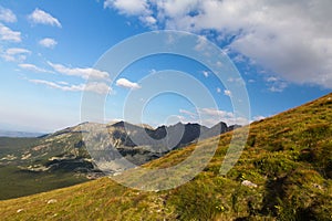 View on mountais in summer and blue sky with clouds