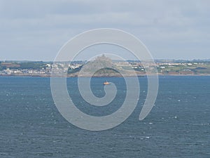 View from Moushole to the blue sea of the Cornish coast and Saint Michael\'s Mount Cornwall England