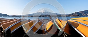 View of Mt. Fuji or Fuji-san with yellow boat and clear sky at lake kawaguchiko, Japan