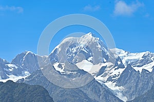 The view of Mt. Tasman peak, one of the famous landmark, near Mt. Cook in a fresh sunny day under blue sky, West Coast, New