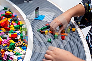 View on multi color plastic bricks at the table.