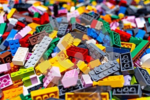 View on multi color plastic bricks at the table.