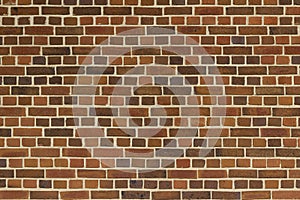 View of a multi hued reddish brown vintage brick wall texture
