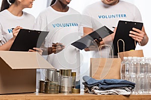 View of multiethnic volunteers with clipboards