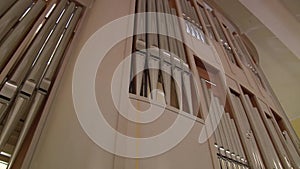 View of the musical instrument organ from the side of listeners and organist.