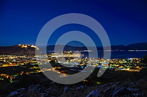 View of Nafplio town and harbour from Prophet Helias or Profitis Ilias hill at night. Argolis, Peloponnese, Greece
