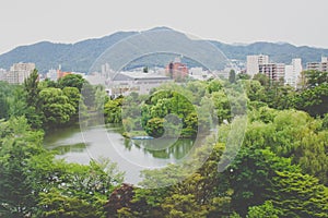 View of Nakajima Park Koen with cityscape of Sapporo City in the background at Hokkaido, Japan