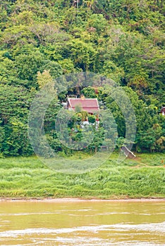 View of the Nam Khan river, Louangphabang, Laos. Copy space for text. Vertical.