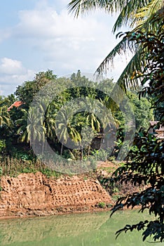 View of the Nam Khan river, Louangphabang, Laos. Copy space for text. Vertical.