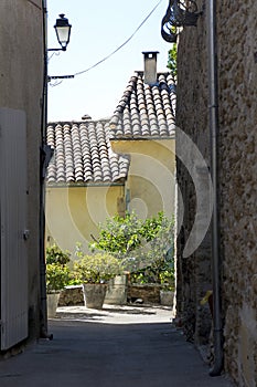 View through a narrow alley, old town in southern Europe