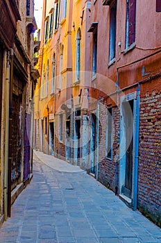 view of a narrow brick street in italian city venice...IMAGE