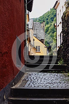 View of the narrow paved street and medieval houses