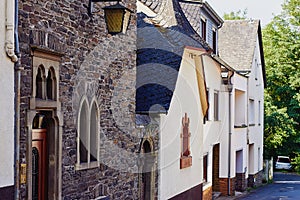 View of the narrow paved street and medieval houses
