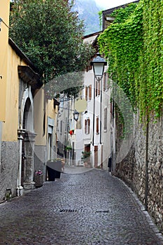 View of a narrow street in Arco, North Italy photo