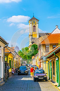 view of a narrow street in the hungarian city szentendre with tower of the blagovestenska church on background....IMAGE