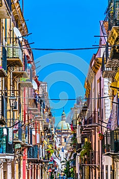 View of a narrow street leading to chiesa del carmine maggiore in Palermo, Sicily, Italy