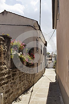 View of narrow street and old buildings in Koper