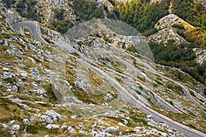 Winding narrow road in Biokovo mountain range, Sveti Jure summit, Makarska riviera, Dalmatia, Croatia