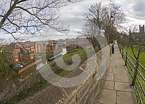 View of narrowboat moored on a British canal in urban setting