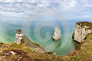 View of natural chalk cliffs of Etretat