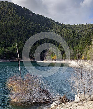 A view of the natural Lake Tsivilu Peloponnesus, Greece and mountains around on a cloudy winter day