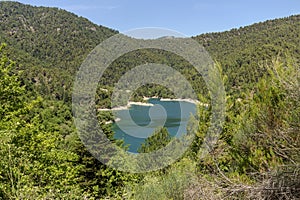 A view of the natural Lake Tsivilu Peloponnesus, Greece and mountains around on a sunny, summer day