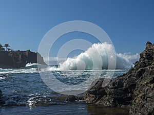 View of natural rock swimming pool Charco de Isla Cangrejo in the Atlantic Ocean in Los Gigantes, Tenerife, Canary islands, Spain