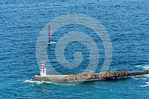 View on a navigational light at the harbor entrance