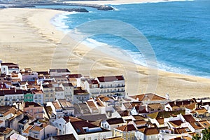 View on Nazare beach on the coast of Atlantic ocean . Portugal