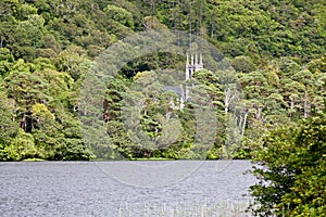 View of the Neo-Gothic church at Kylemore Estate, across the lake, west of Ireland