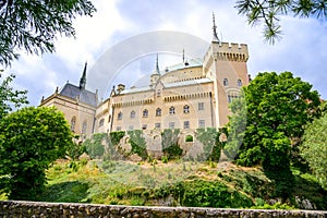 View of neogothic Bojnice castle with small fortification wall from Castle park Bojnice, Slovakia