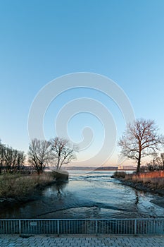 View from Neuenfelder lock at Elbe River at low tide at late afternoon.