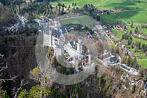 View of Neuschwanstein Castle and Alps valley near Fussen from above, Germany