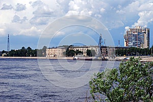 View of the Neva river, a barge with a crane and old residential buildings. Urban landscape. City Of Saint Petersburg.