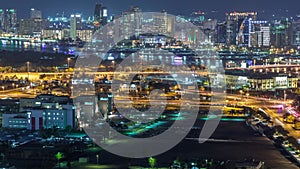 View of new modern buildings at nighttime in luxury Dubai city, United Arab Emirates Timelapse Aerial