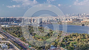 View of new modern buildings at sunny day in luxury Dubai city, United Arab Emirates Timelapse Aerial