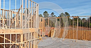 View of a newly built home under construction with wood framing beams