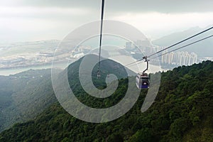 View from Nhong Ping 360 cable car crossing over the mountain in Tung Chung and Lantau Island photo