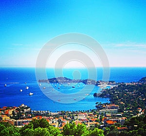 View of Nice, Villefranche-sur-Mer, Cape Cap-Ferrat on a bright sunny day. Cote d`Azur, French Riviera, France