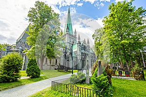 View on Nidaros Domkirke from garden and cemetry in the Norwegian city of Trondheim in summer