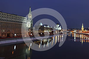 View of the night winter Moscow with the Moscow river, Sofiyskaya and Kremlevskaya embankments. photo