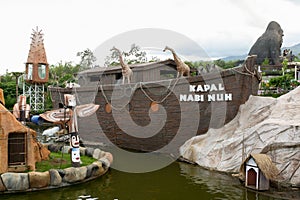 View of Noah ark replica in theme park with clouds in blue sky background. No people.